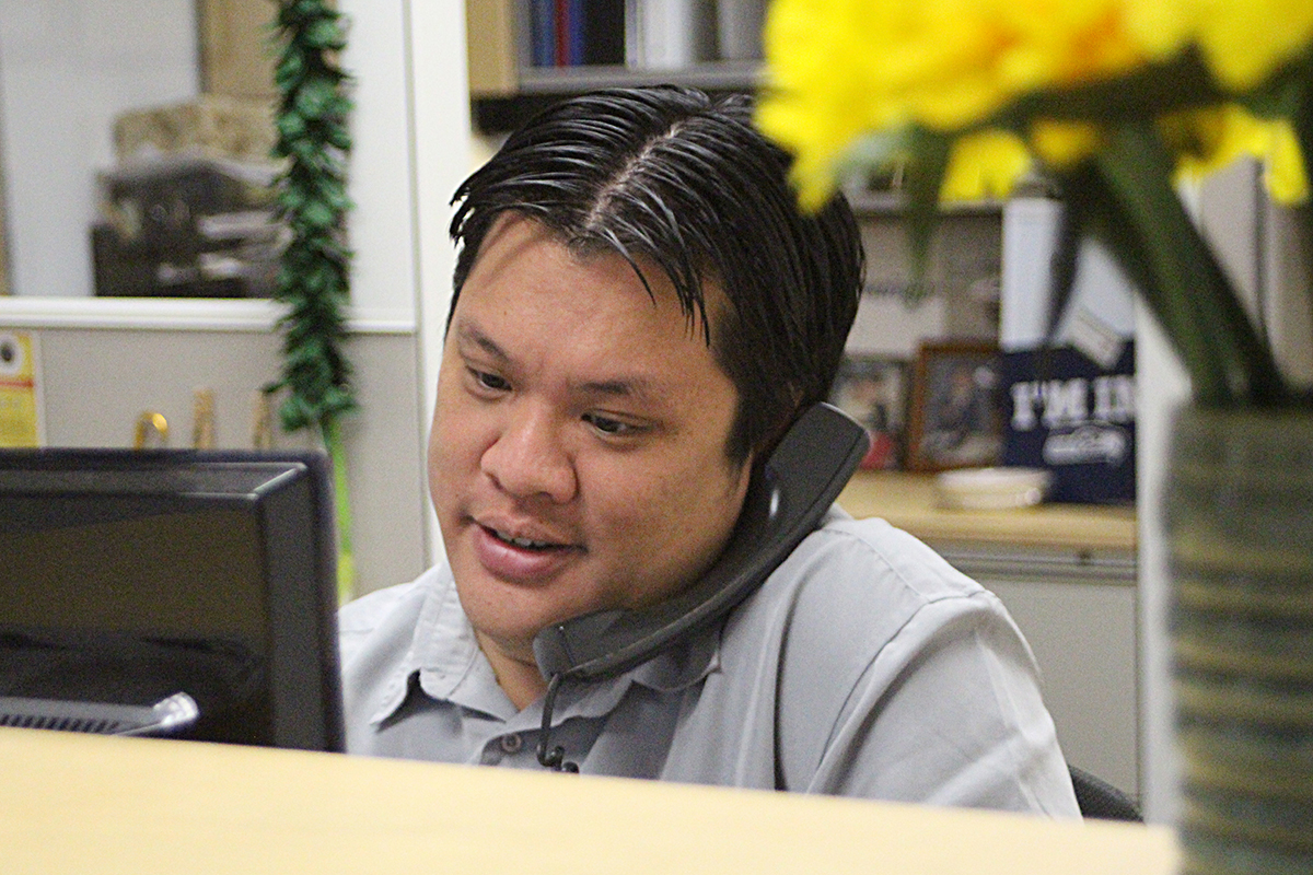 Nick Choy calmly helping a phone caller